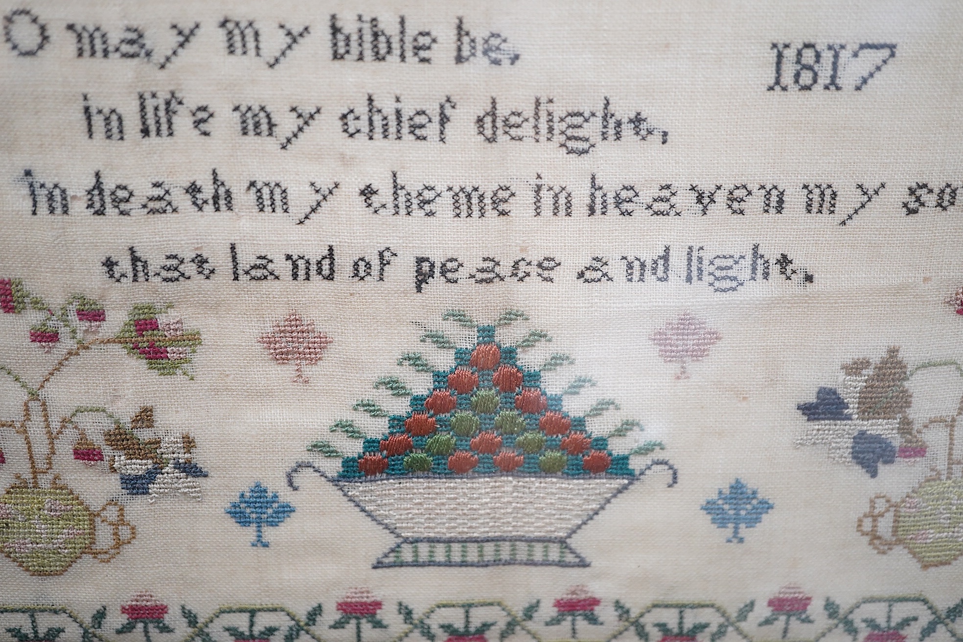 Two early 19th century finely worked samplers: One 'A Sublime Thought', dated 1822 by Ann Dudley, simply worked with verse and a wide vineous border and two oak trees, the other a register of the children of Samuel and A